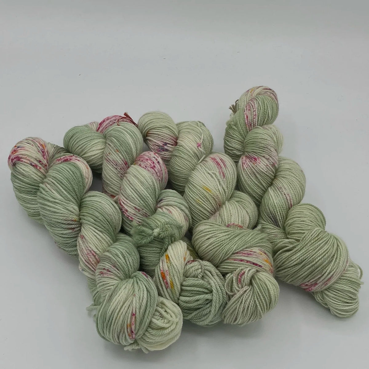 Gnome Depot Fiber DK weight Yarn in Soft Green with Colorful Specks for Knitting and Crocheting Projects