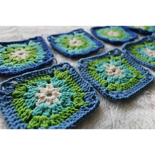 granny square crochet workshop showing blue green cream crochet squares in progress for beginner class