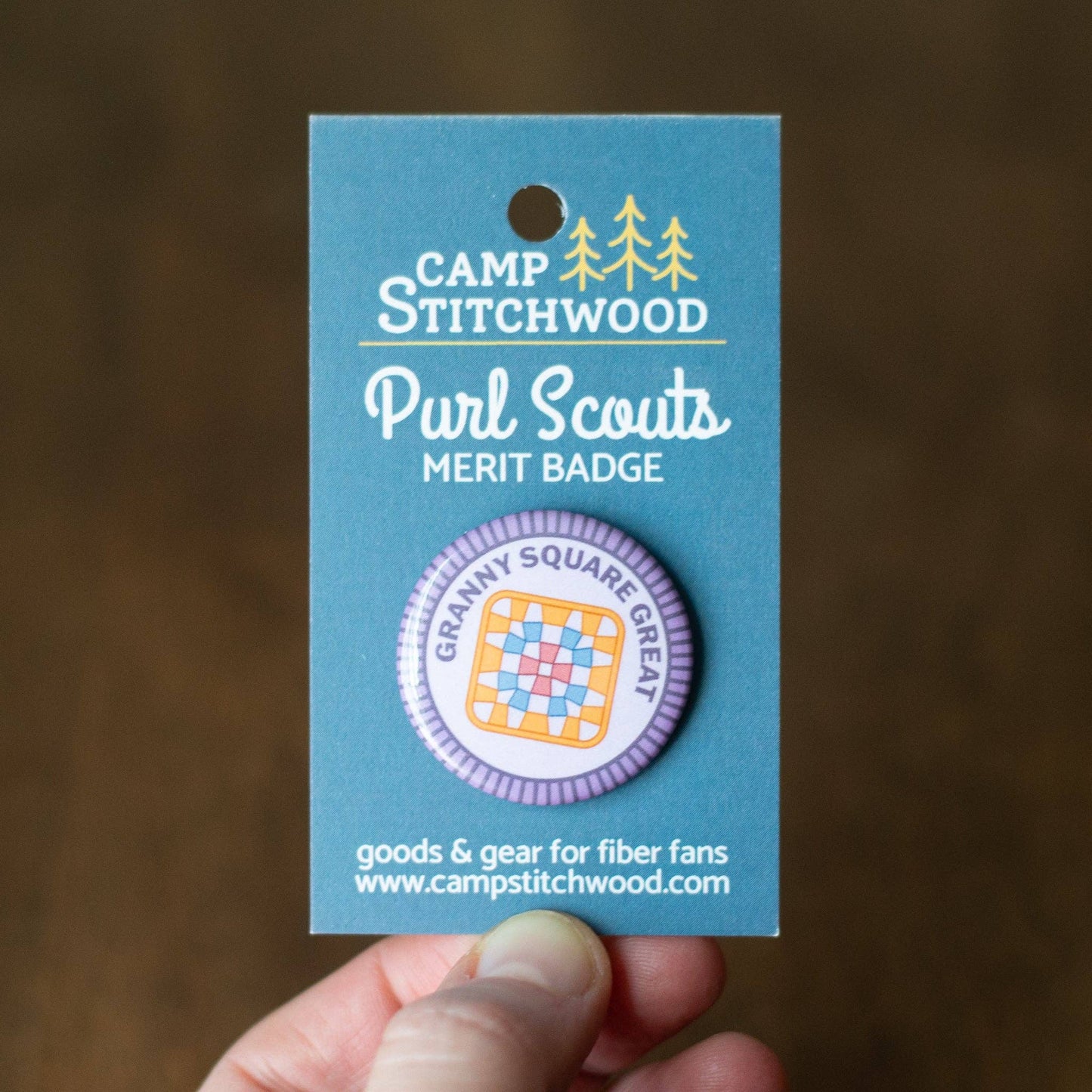 Camp Stitchwood Purl Scouts Merit Badge featuring a square granny square pattern design
