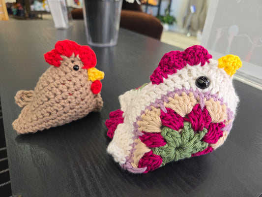 AriYARN Shop and Studio after school crochet club two handmade crocheted chickens with colorful accents on table
