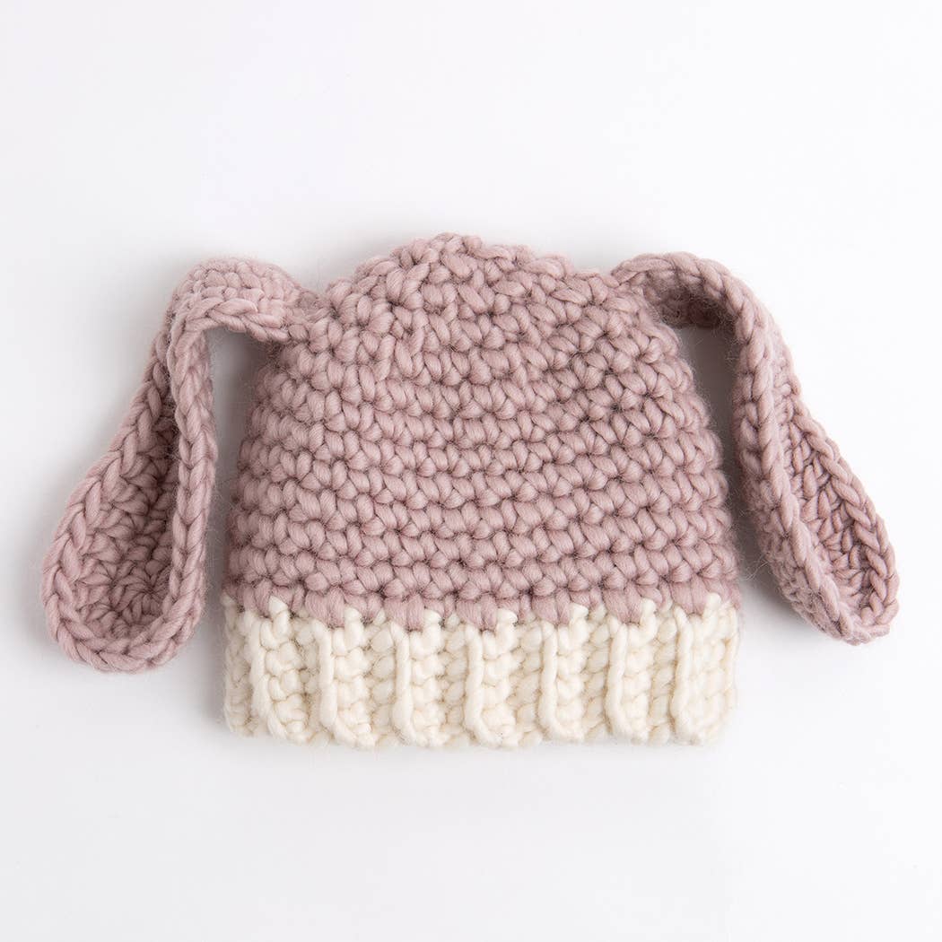 child wool bunny hat pattern chunky pink knit with cream ribbed brim and floppy bunny ears for toddlers