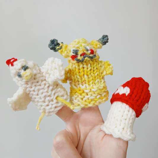 AriYARN Shop and Studio workshop display of three knitted finger puppets on a hand yarn crafts for children near Chicago