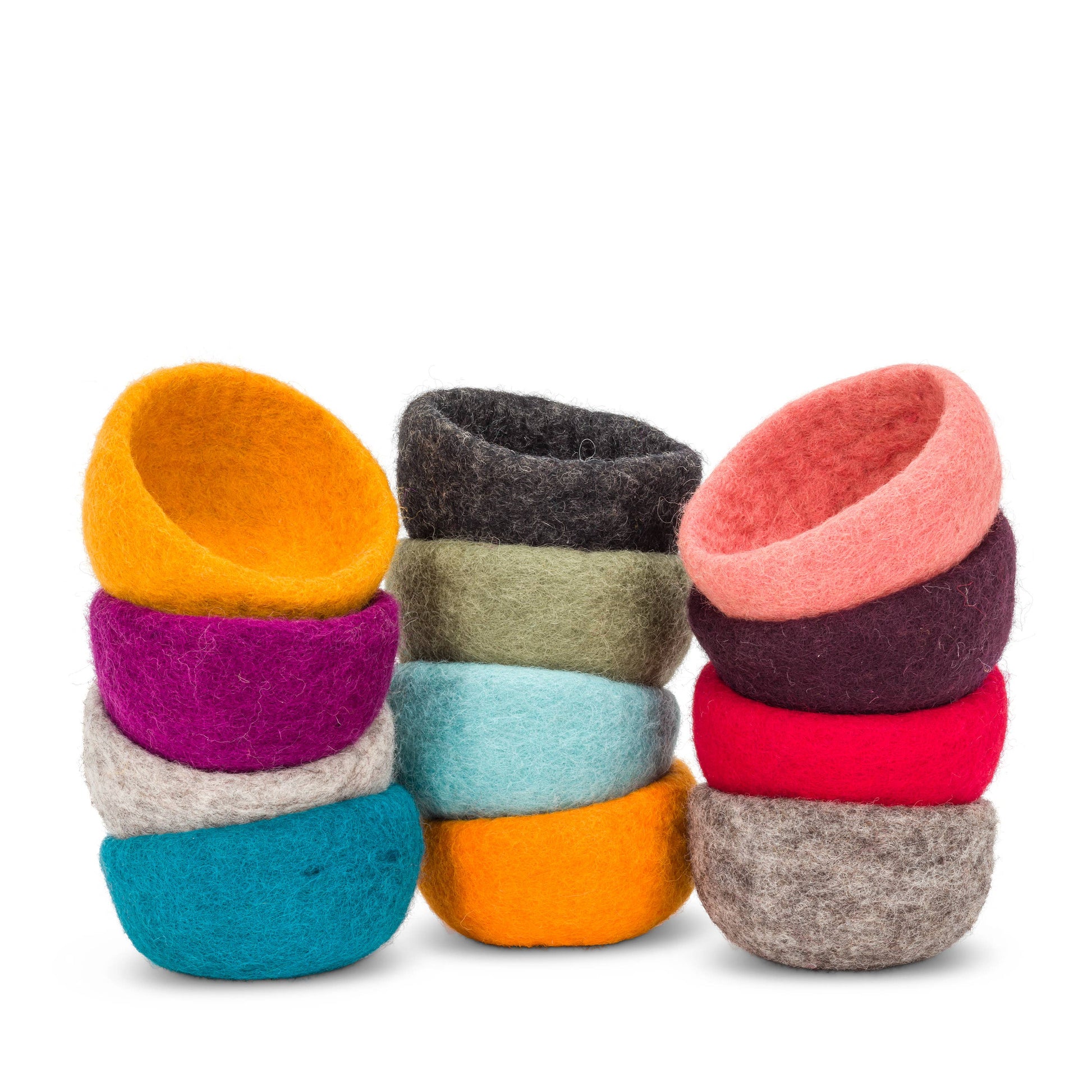 Colorful handmade yarn storage bowls stacked together for organizing crafting supplies