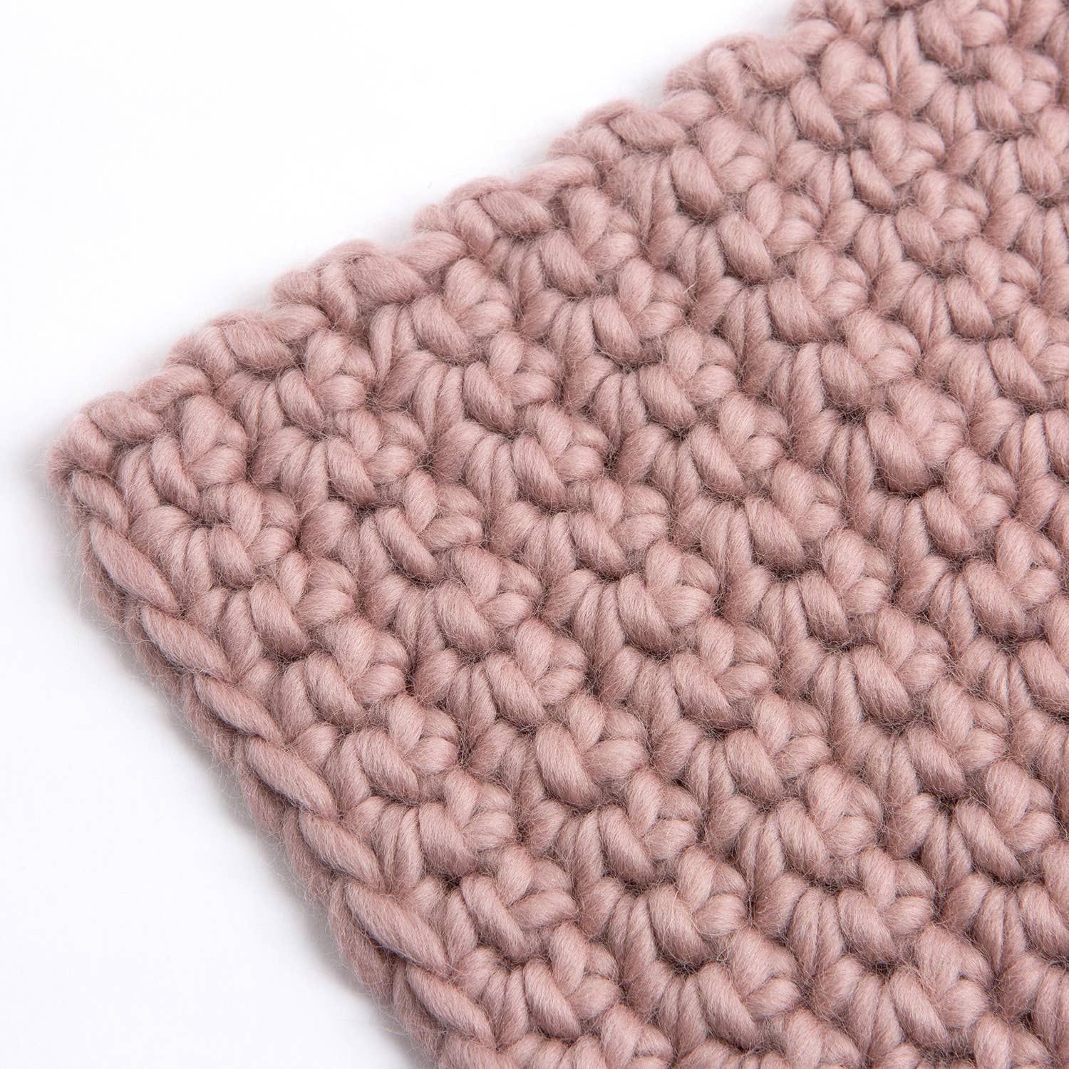 Hannah's crochet kit for beginners blush pink chunky wool swatch showing large textured stitches and soft yarn
