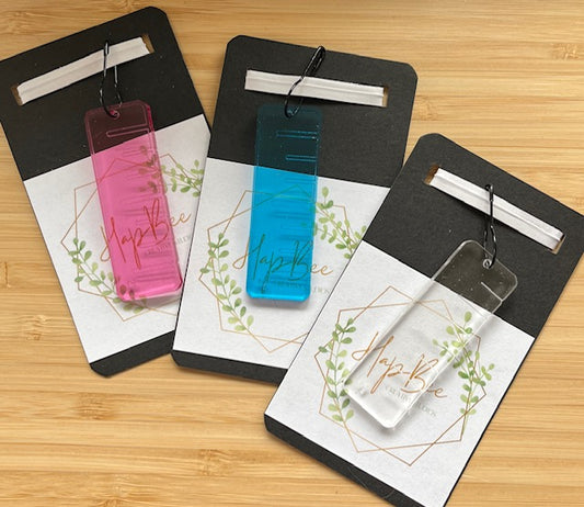 HapBee ruler stitch marker set of three translucent acrylic gauges in pink blue and clear on packaging