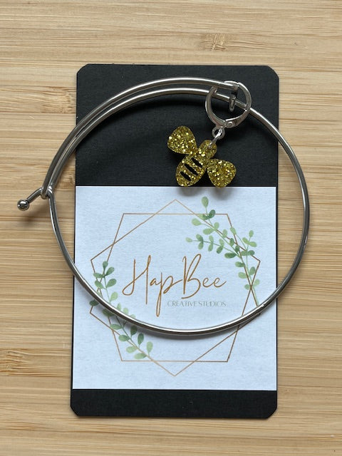 HapBee Creative Studios silver knitting bracelet with stitch marker glitter bee charm on branded card