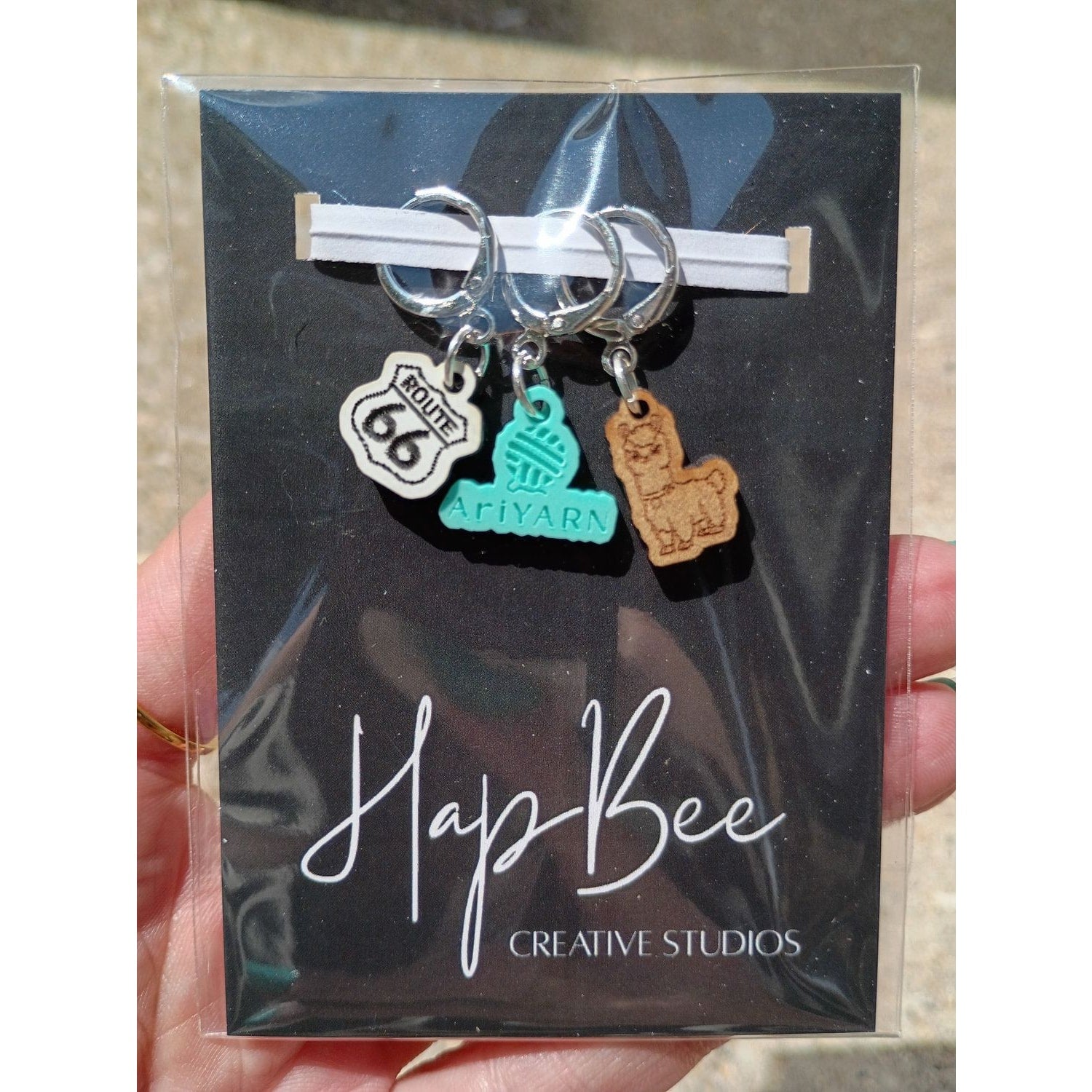 Cute stitch markers for crocheting featuring Route 66 and llama designs by HapBee Creative Studios