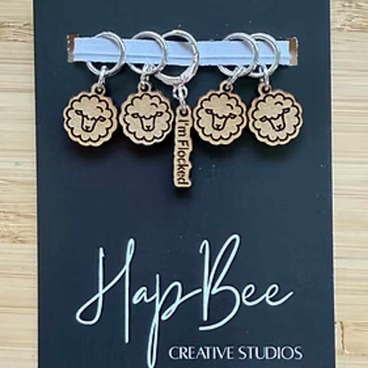 HapBee Creative Studios Wooden Stitch Markers for Crocheting featuring sheep designs and a unique charm