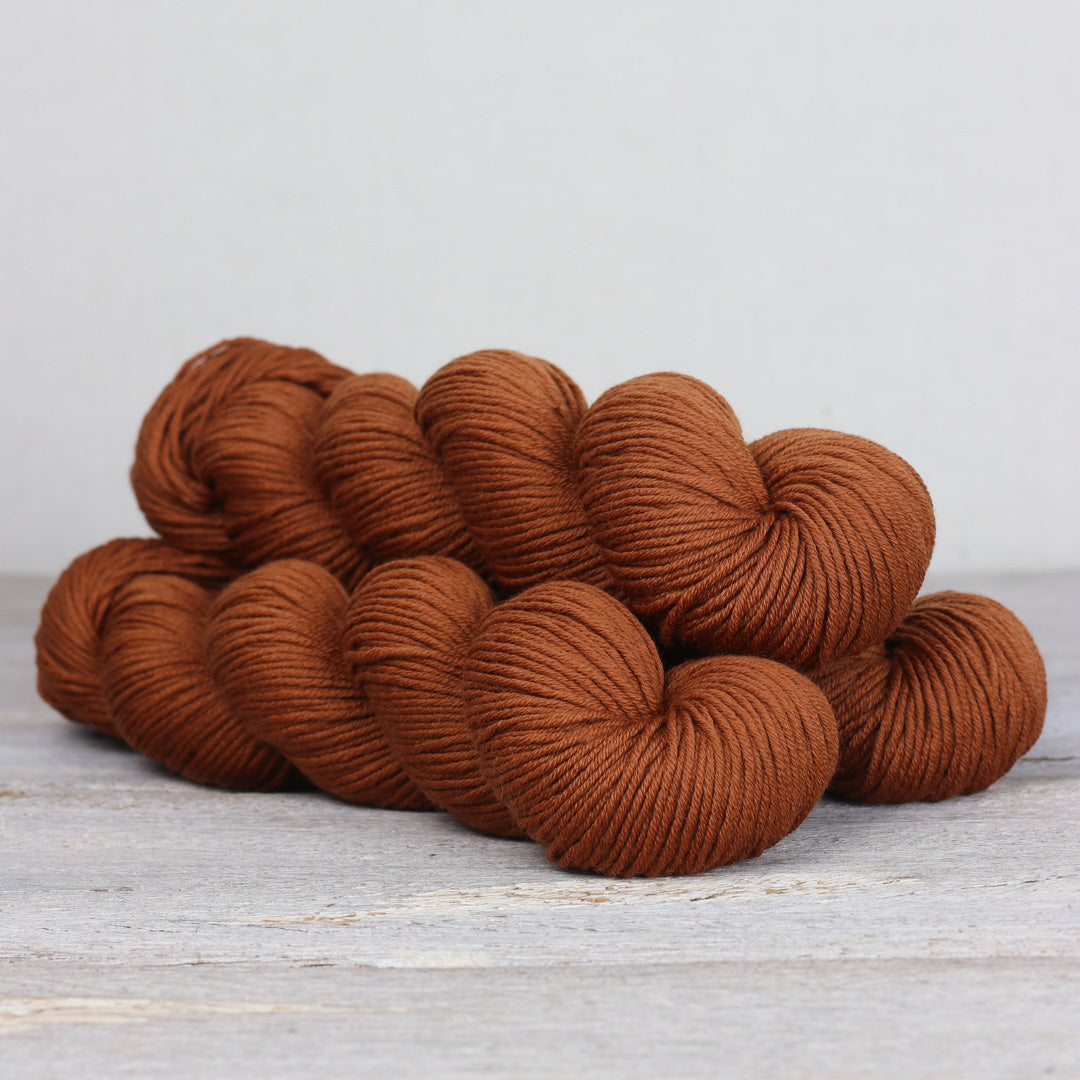 Rich brown Herb & Hue yarn for knitting, perfect for cozy winter projects