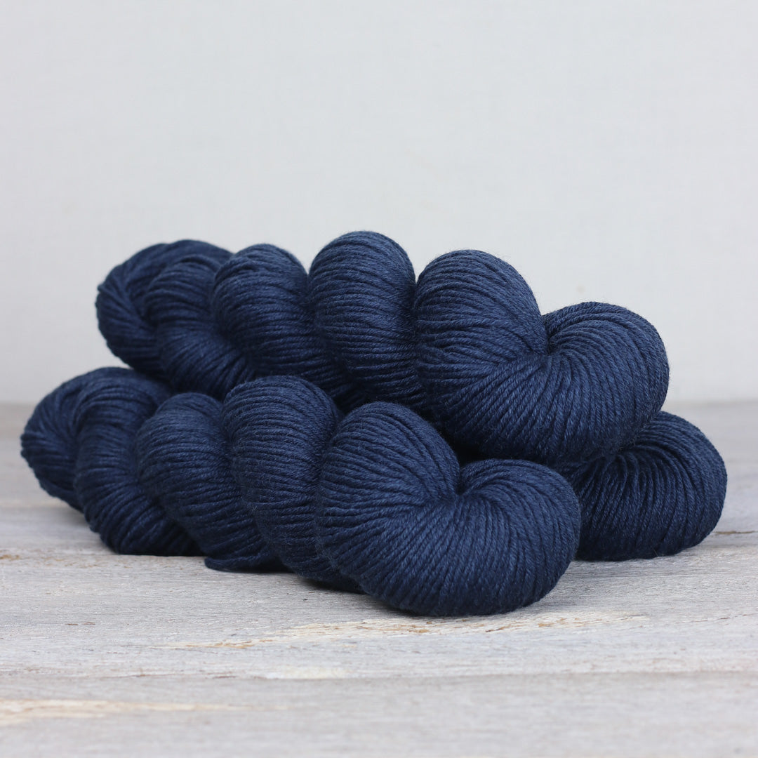 Soft navy Herb & Hue yarn for knitting, perfect for cozy projects and creative designs