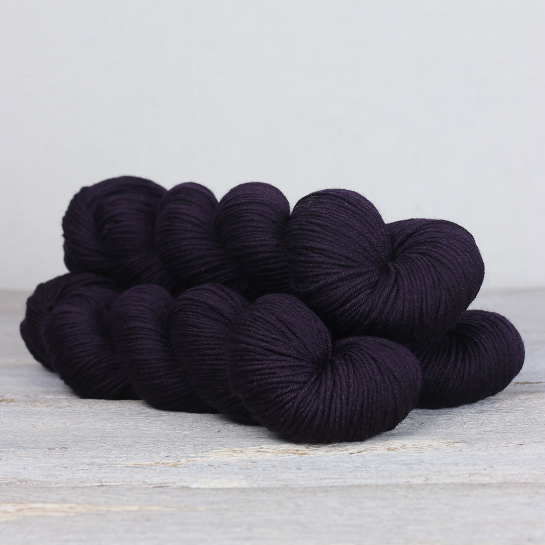 Deep purple Herb & Hue yarn for knitting, perfect for cozy projects and soft textures