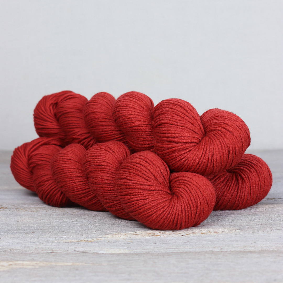 The Fibre Co. Herb & Hue yarn for knitting in rich red color, ideal for cozy projects
