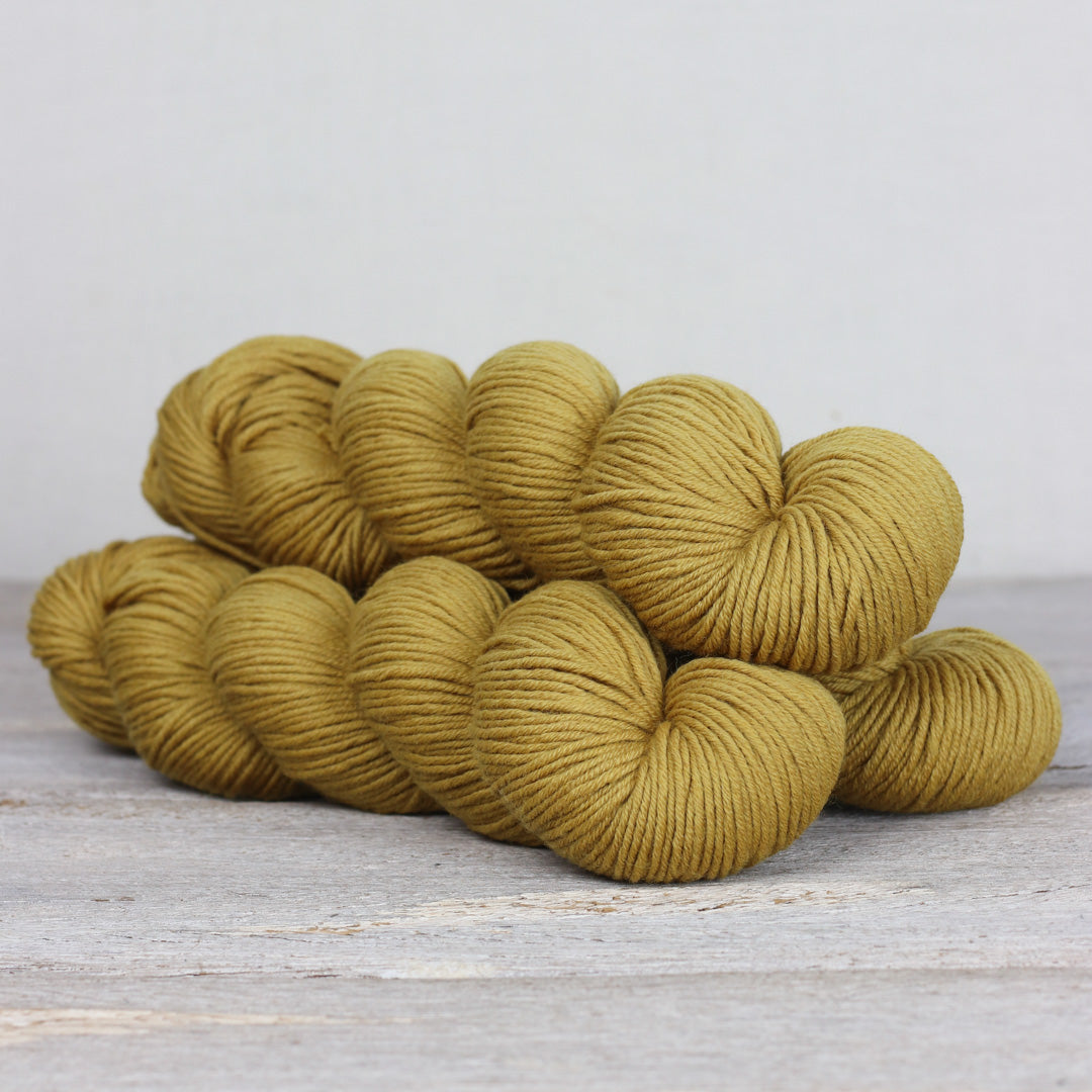 Herb & Hue yarn for knitting in warm mustard color, ideal for cozy projects