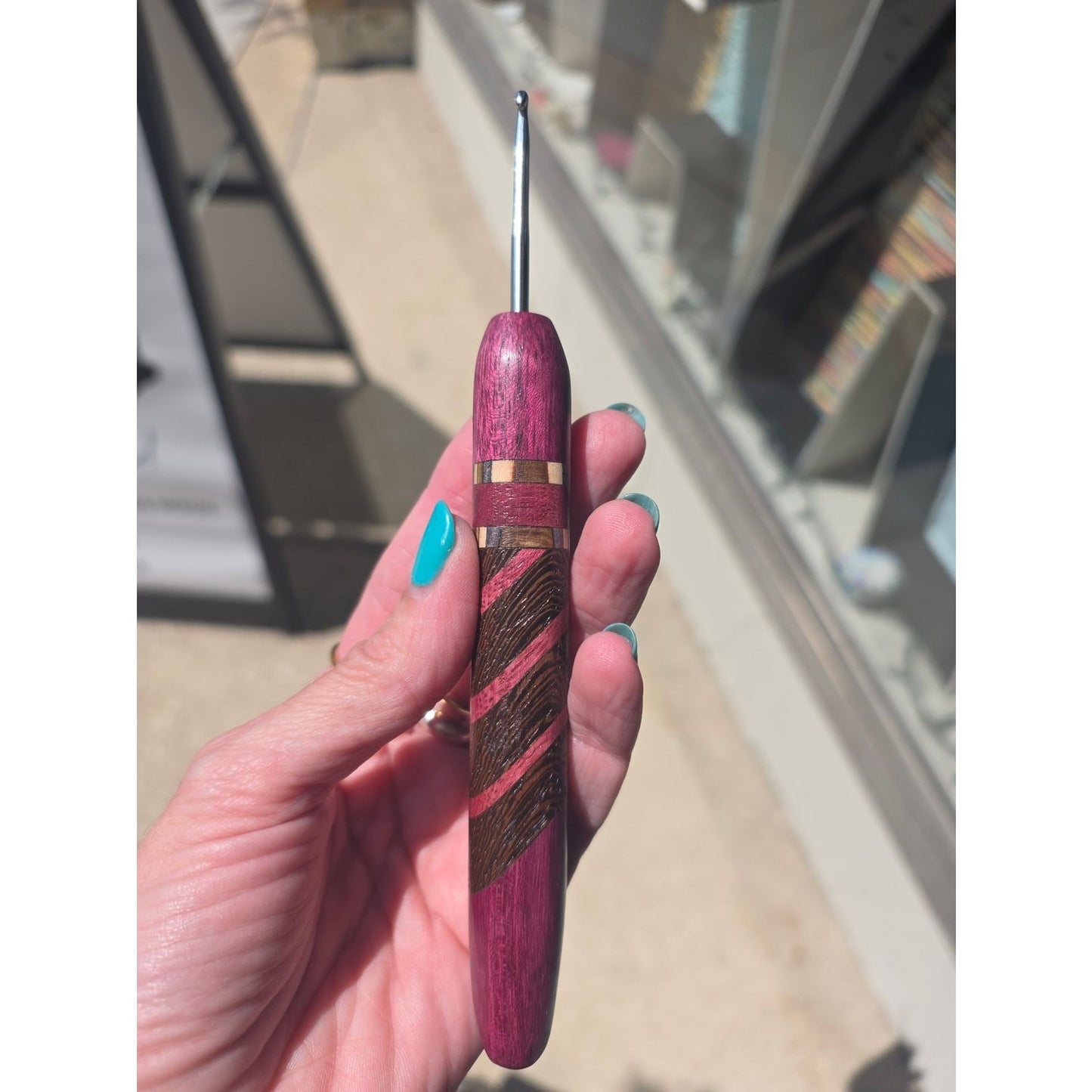Knitbrooks ergonomic crochet hook in purple wood, ideal hooks for crochet projects.