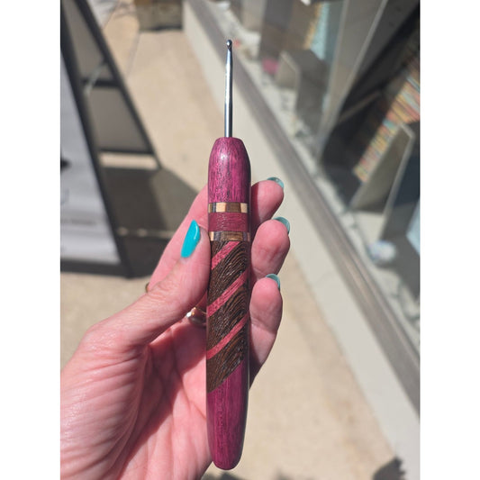 Knitbrooks ergonomic crochet hook in purple wood, ideal hooks for crochet projects.