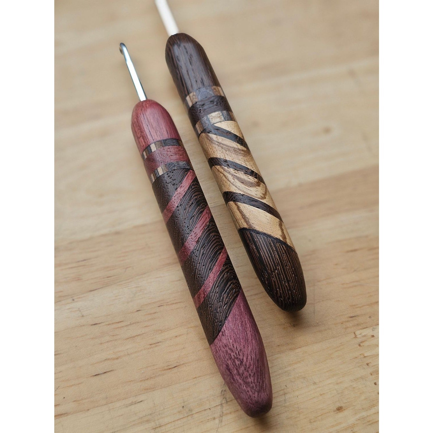 Knitbrooks handcrafted wooden hooks for crochet featuring colorful striped designs