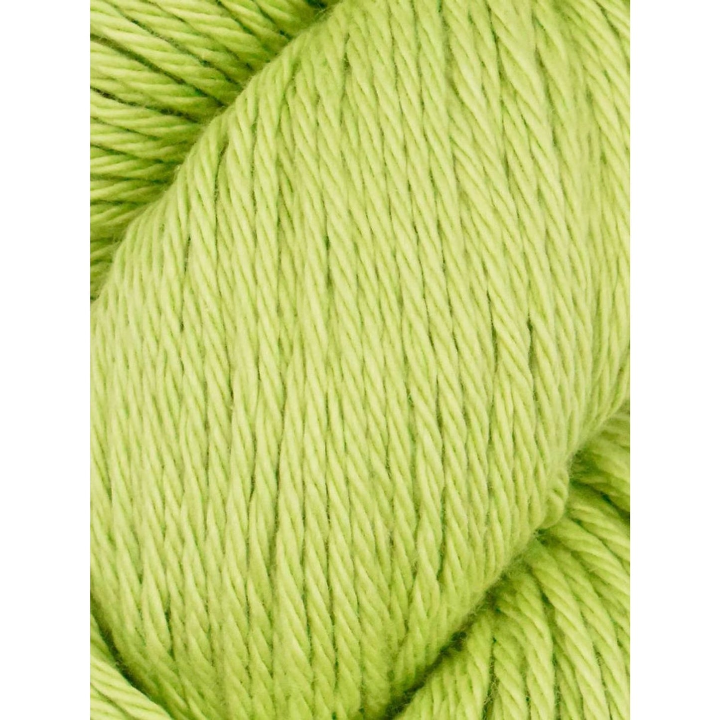 Vibrant green yarn from Juniper Moon Farm ideal for knitting and crochet projects