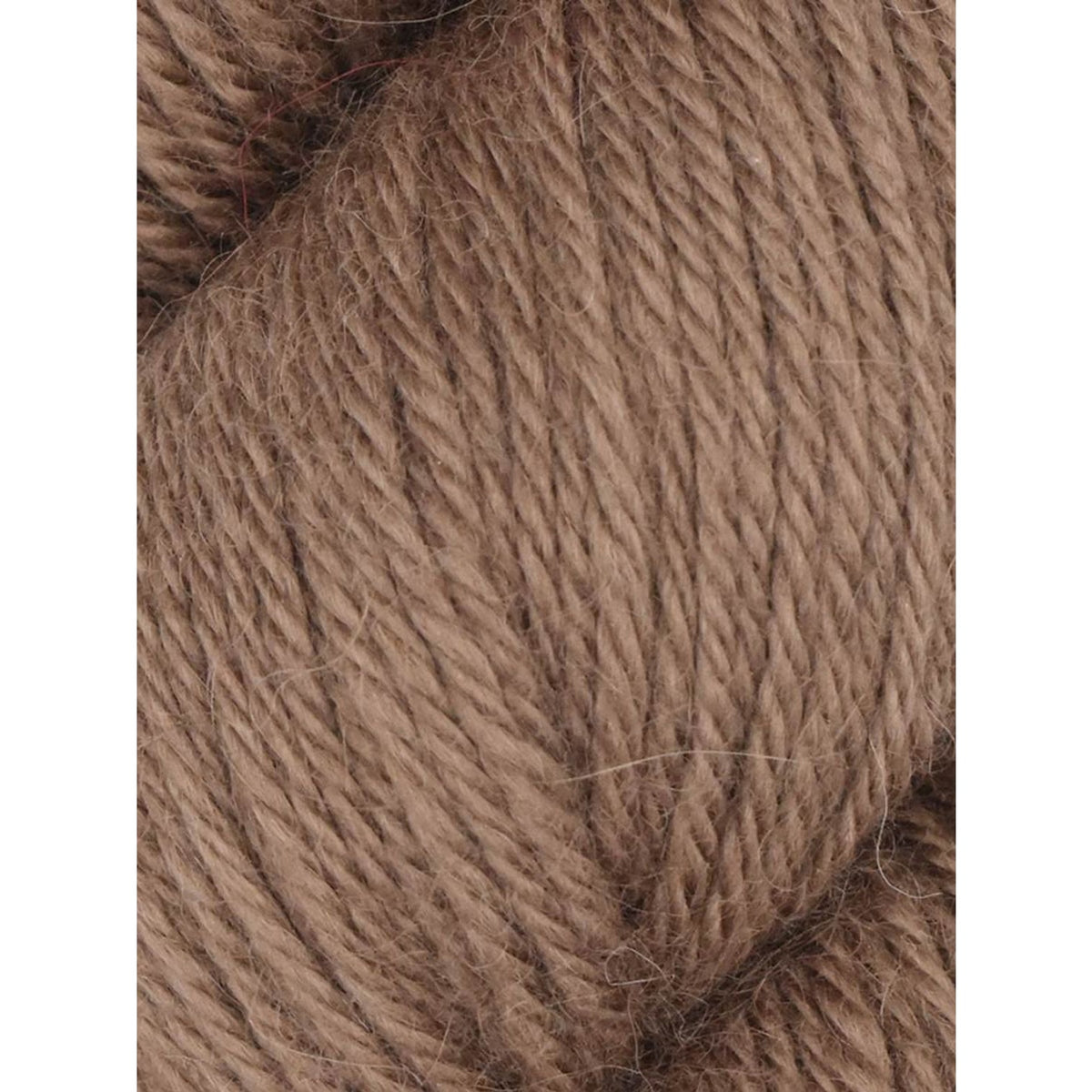 Soft brown Juniper Moon Farm Herriot yarn skein ideal for cozy knitting projects