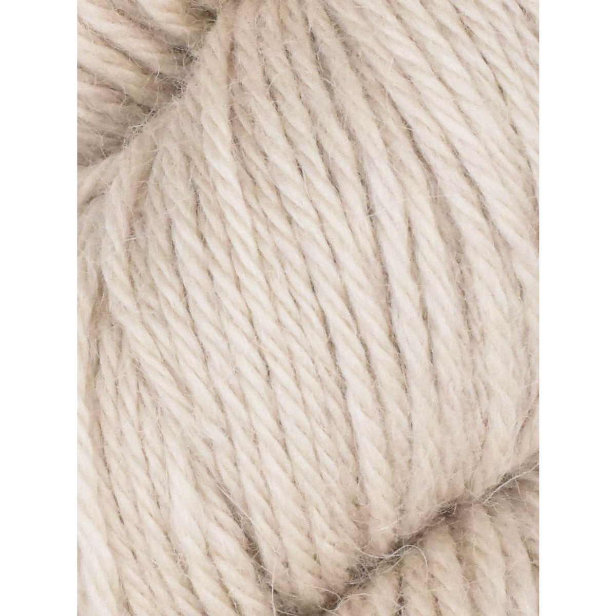 Soft beige Juniper Moon Farm Herriot yarn perfect for cozy knitting projects