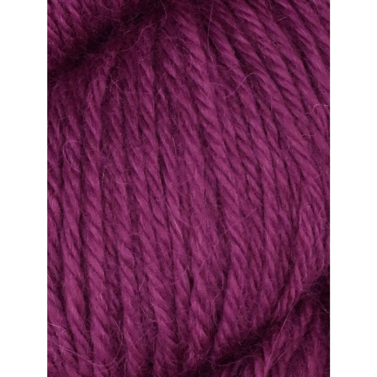 Deep purple Juniper Moon Farm Herriot yarn in a soft, smooth texture ideal for knitting projects