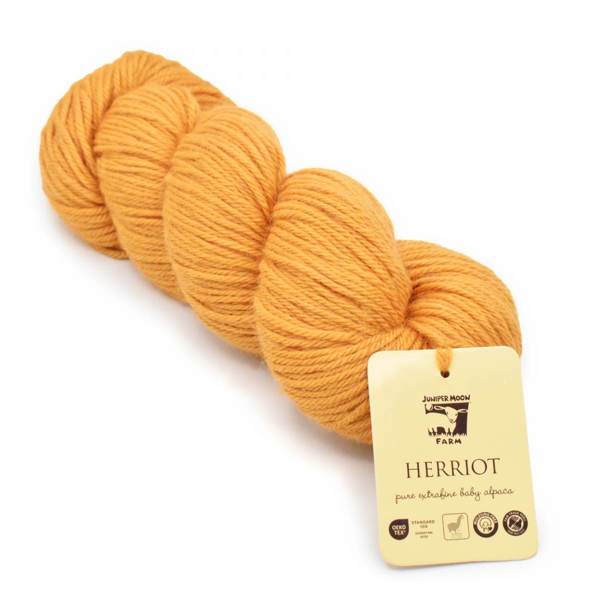 Juniper Moon Farm Herriot yarn in a rich golden color, ideal for soft, cozy knitting projects