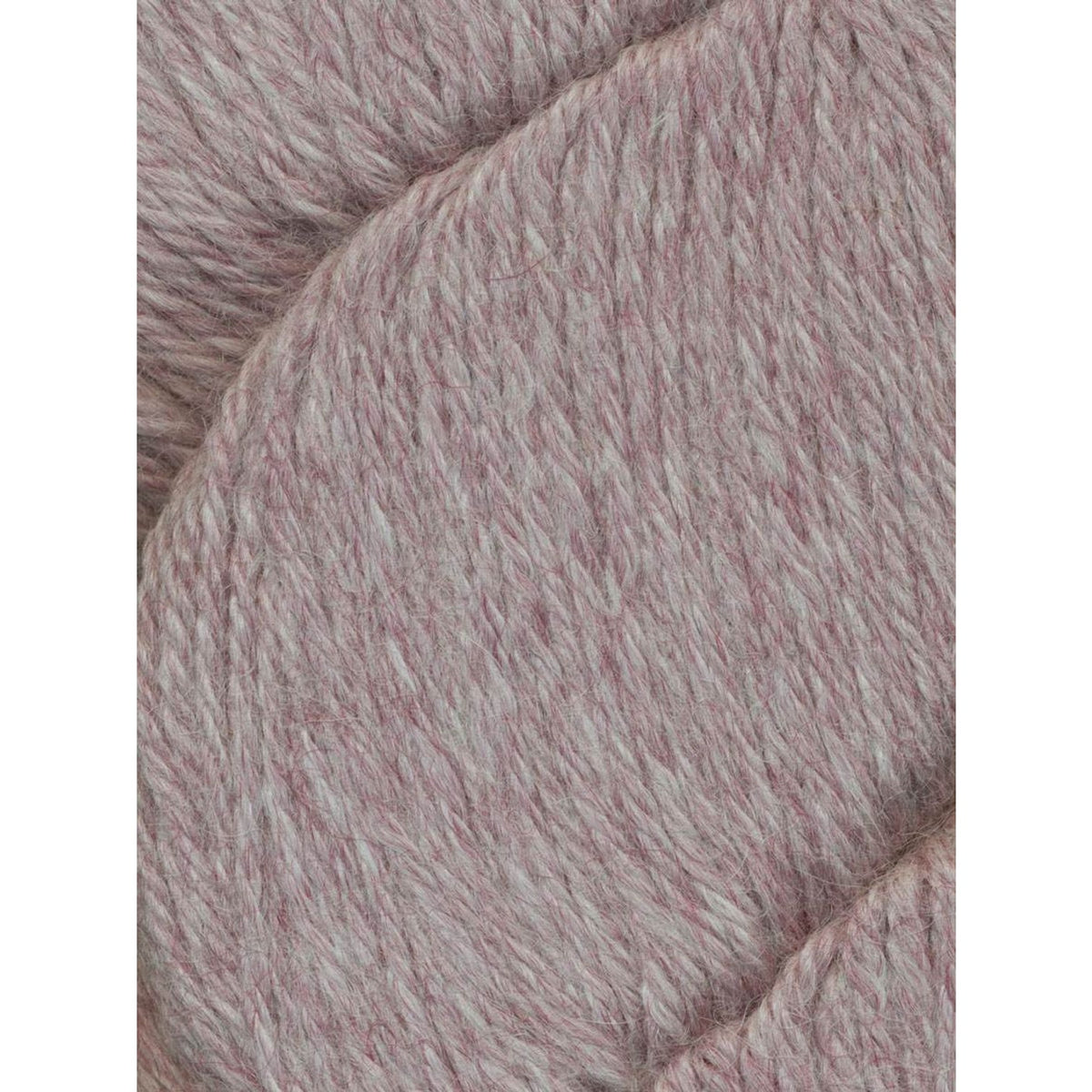 Soft Juniper Moon Farm Herriot yarn in a delicate light pink shade for cozy knitting projects