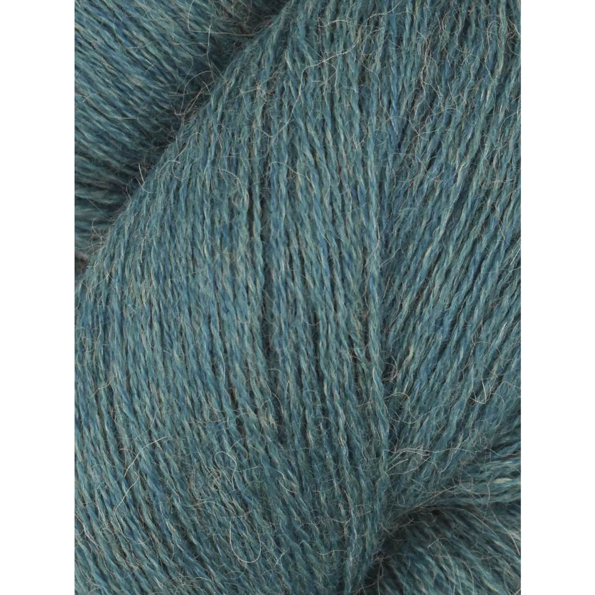 Soft Juniper Moon Farm Herriot yarn in a rich blue-green color for knitting and crocheting projects