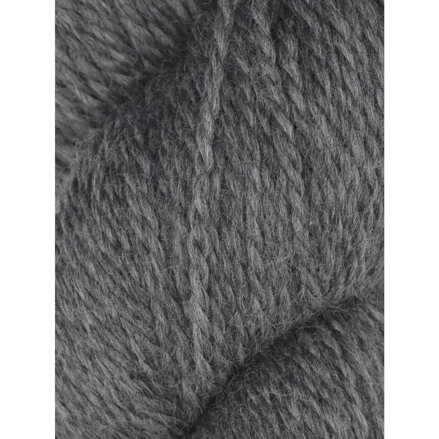 Close up gray wool skein of Juniper Moon Farm Rambouillet yarn by Knitting Fever showing soft textured fibers
