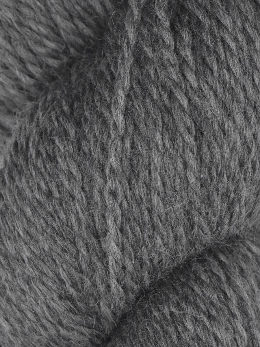 Close up gray wool skein of Juniper Moon Farm Rambouillet yarn by Knitting Fever showing soft textured fibers
