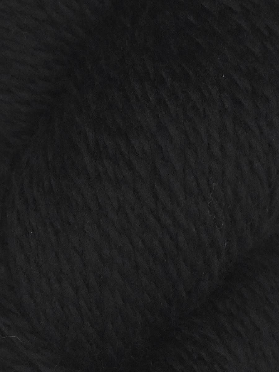 Close up of black soft wool texture in a skein Juniper Moon Farm Rambouillet yarn from Knitting Fever