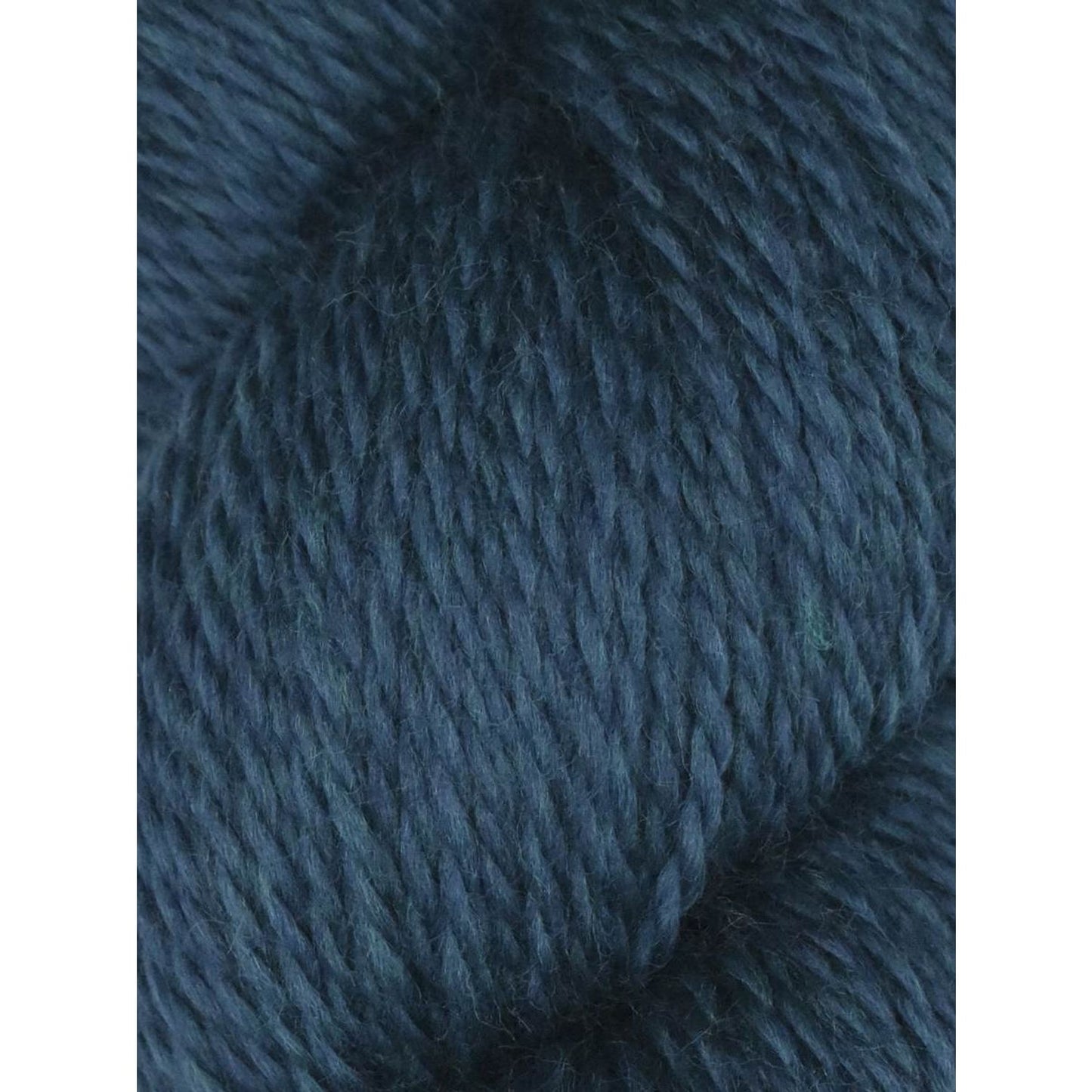 Knitting Fever Juniper Moon Farm Rambouillet yarn close up dark teal blue wool skein texture