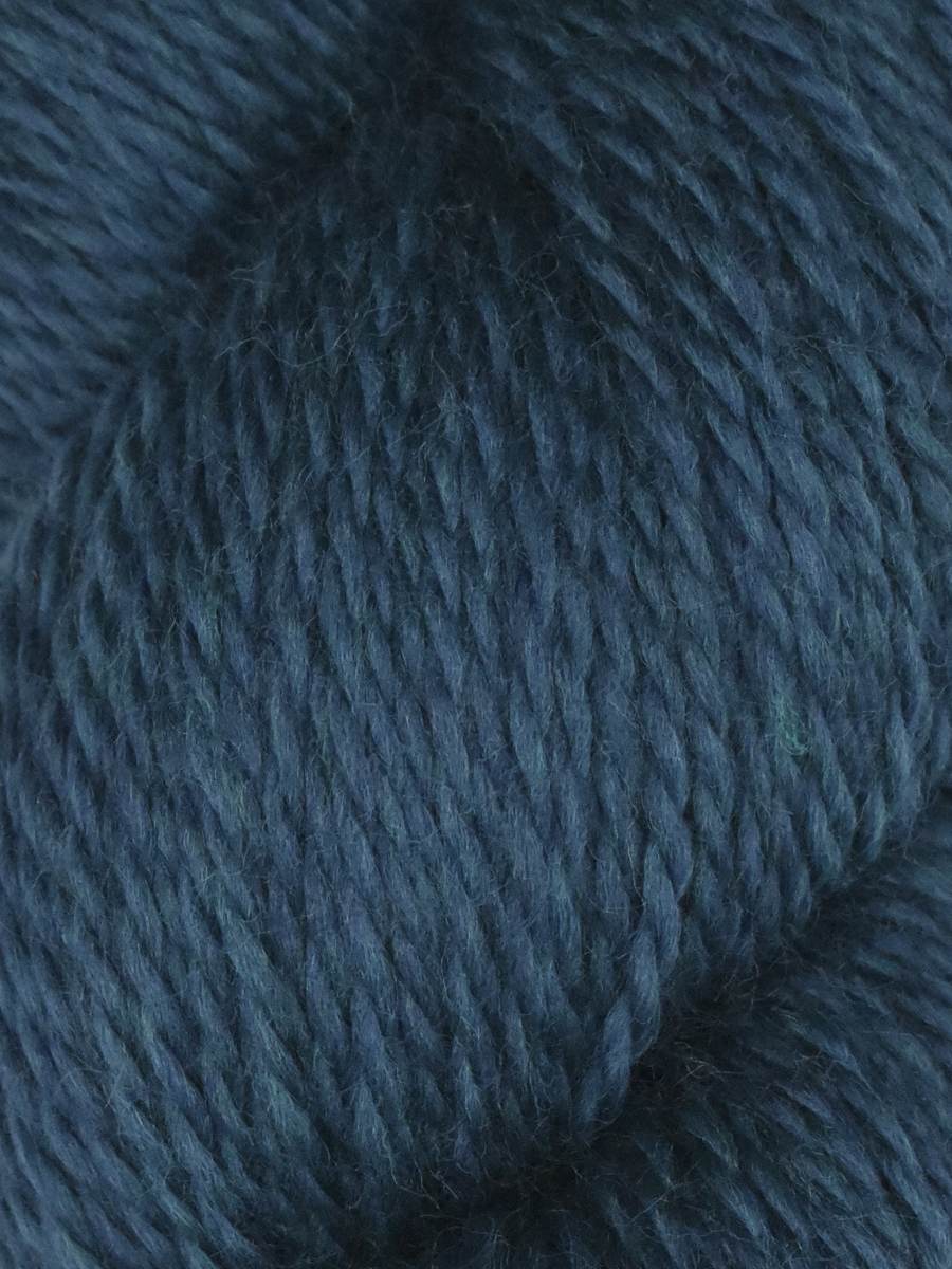 Knitting Fever Juniper Moon Farm Rambouillet yarn close up dark teal blue wool skein texture
