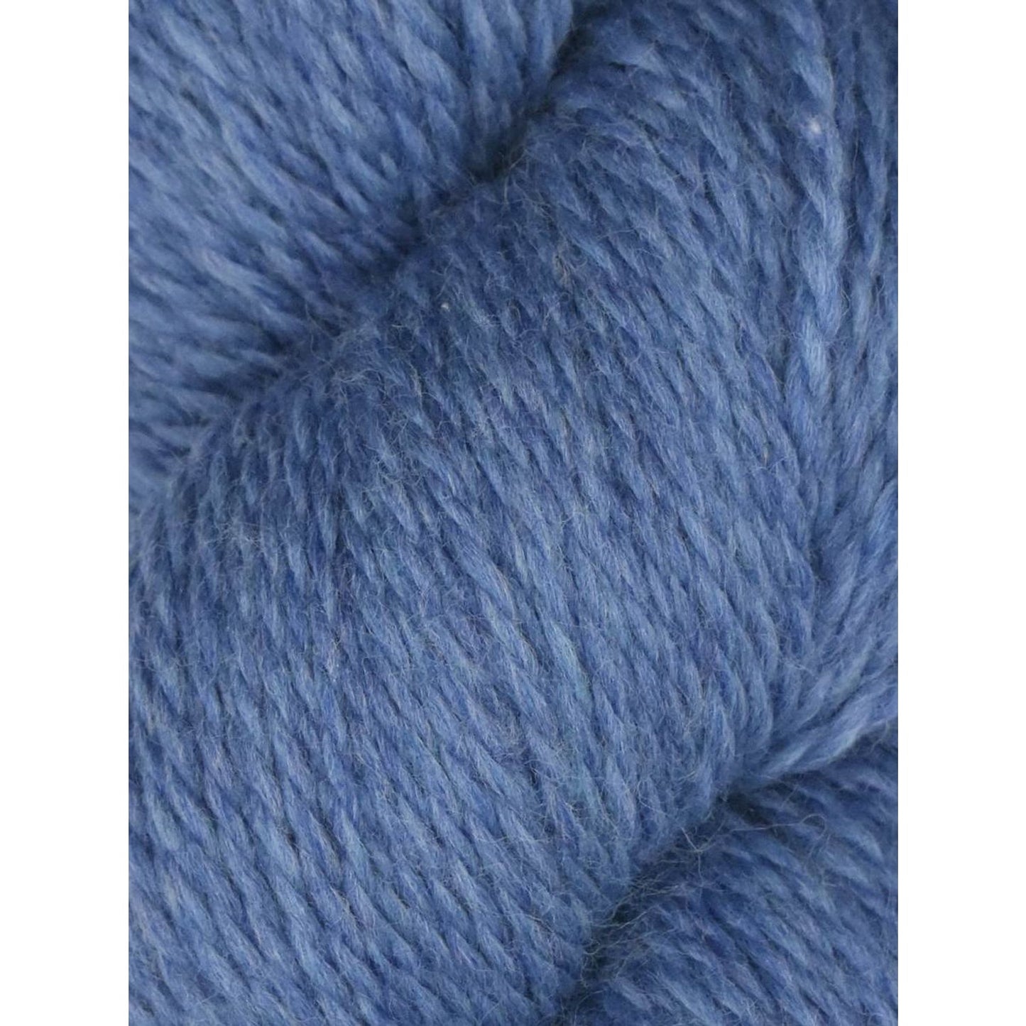Close up of soft heathered blue skein of Juniper Moon Farm Rambouillet yarn by Knitting Fever