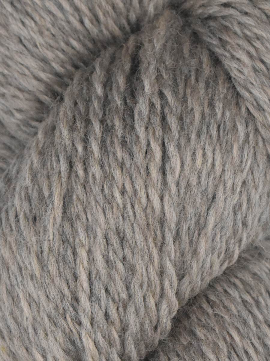Close up of Knitting Fever gray wool skein showing soft heathered texture and ply Juniper Moon Farm Rambouillet yarn
