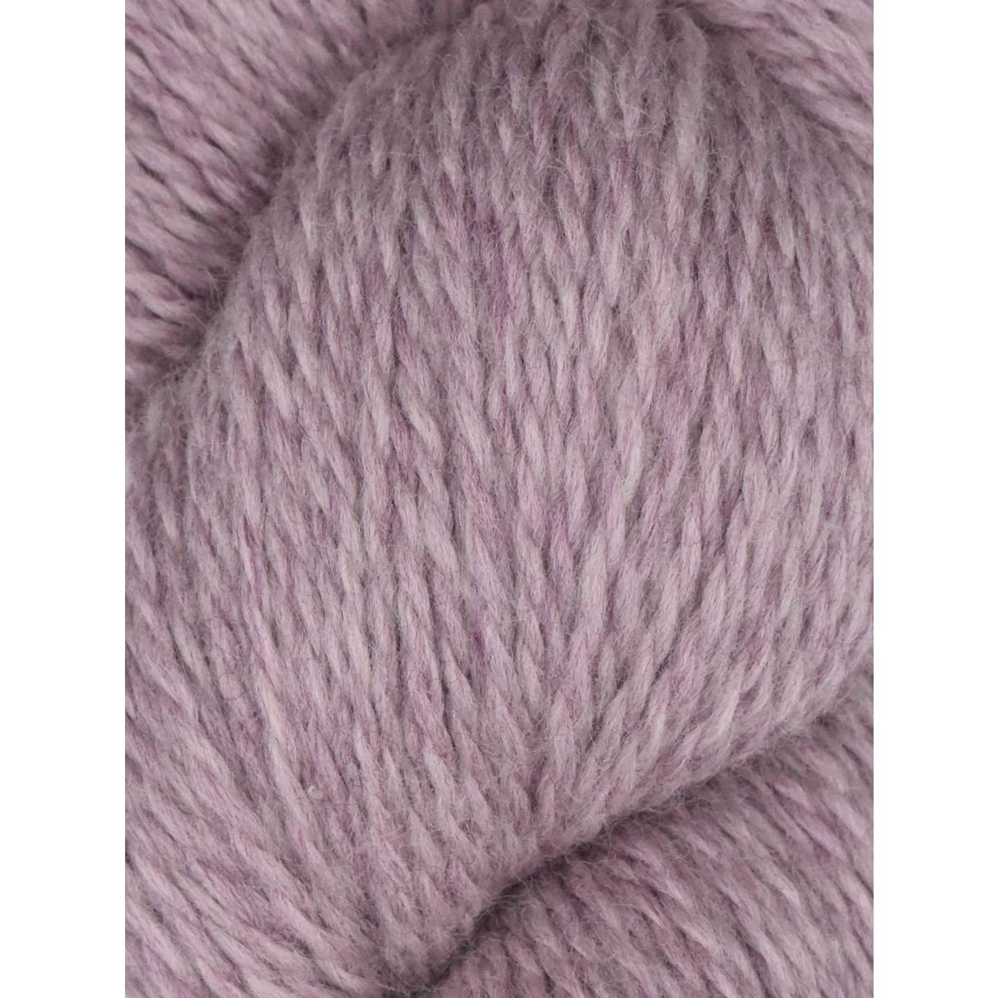 Knitting Fever skein of Juniper Moon Farm Rambouillet yarn in dusty lavender closeup showing soft wool texture