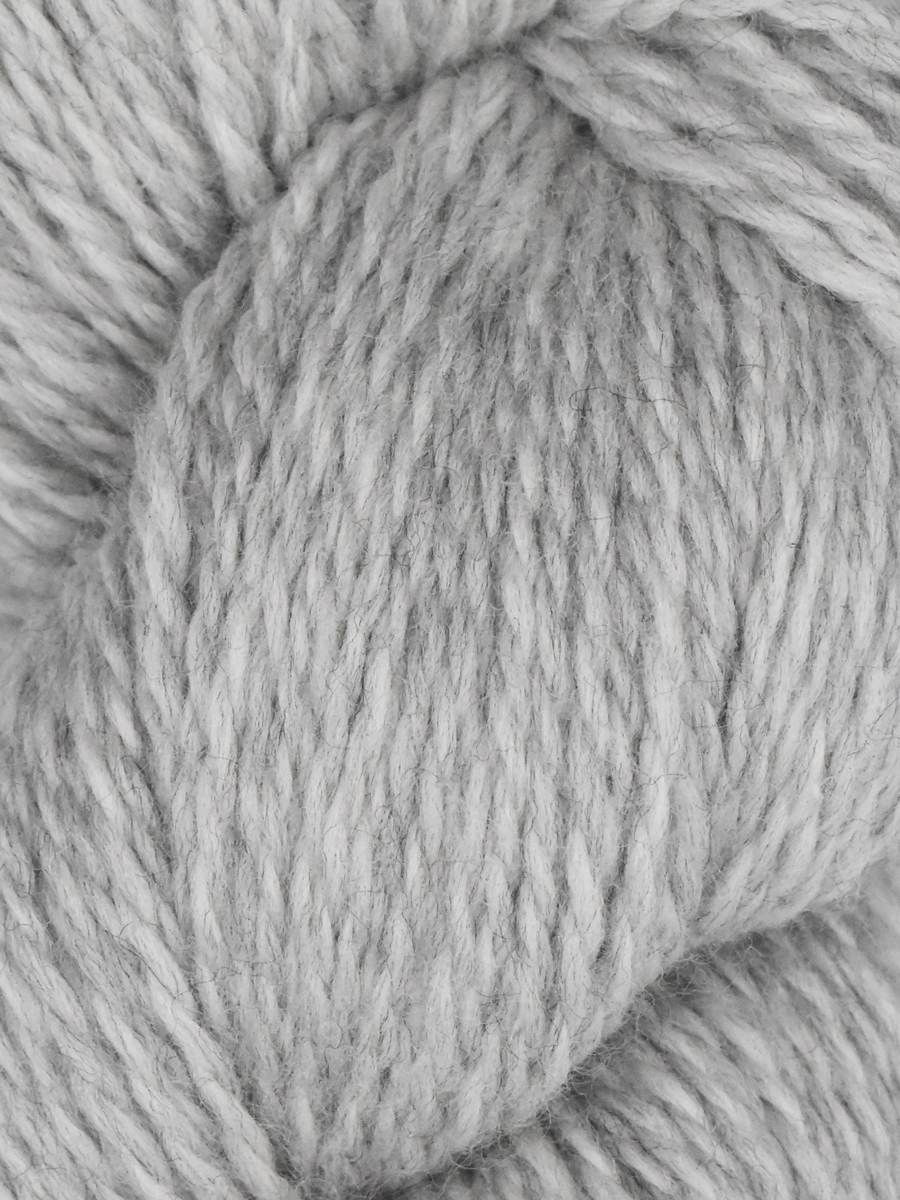 Juniper Moon Farm Rambouillet yarn light gray soft wool skein close up showing texture for cozy knitting projects