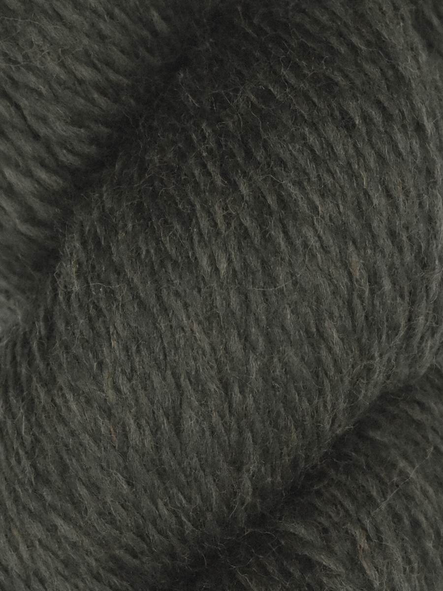 Close up of dark olive green wool skein showing soft texture and twist Knitting Fever Juniper Moon Farm Rambouillet yarn