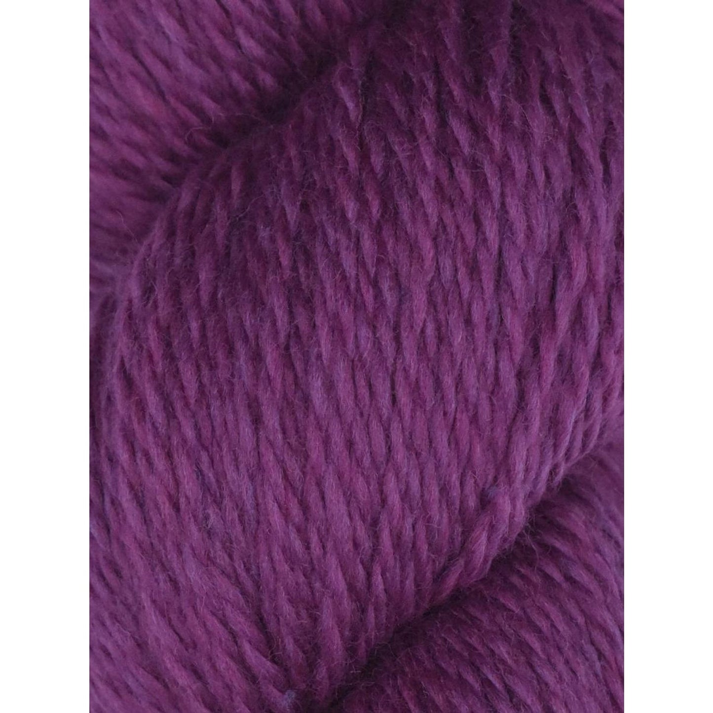 Knitting Fever purple skein close up showing soft texture and ply of Juniper Moon Farm Rambouillet yarn