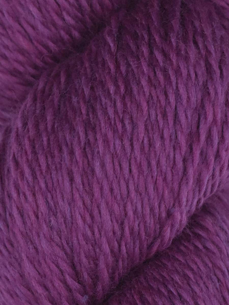 Knitting Fever purple skein close up showing soft texture and ply of Juniper Moon Farm Rambouillet yarn