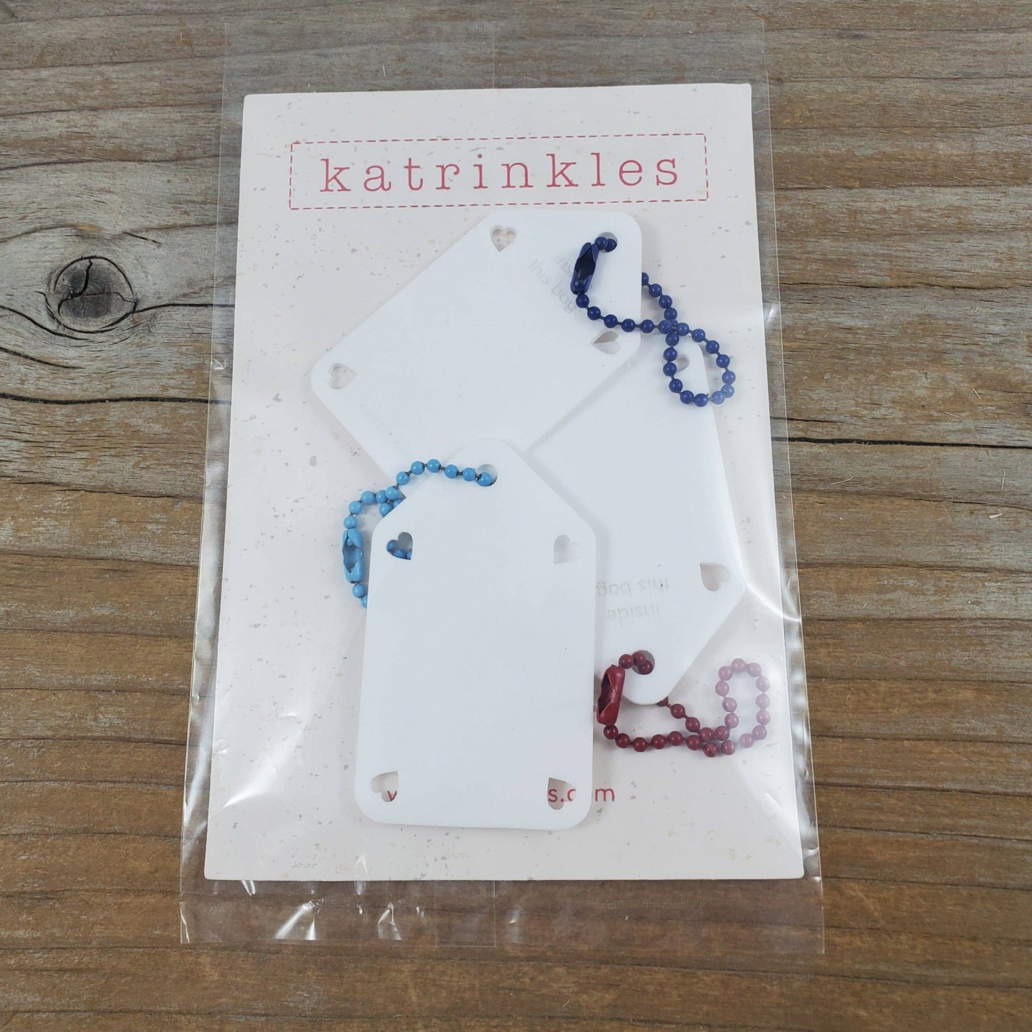 Set of three acrylic name tags by Katrinkles with color-coordinated chains for easy attachment