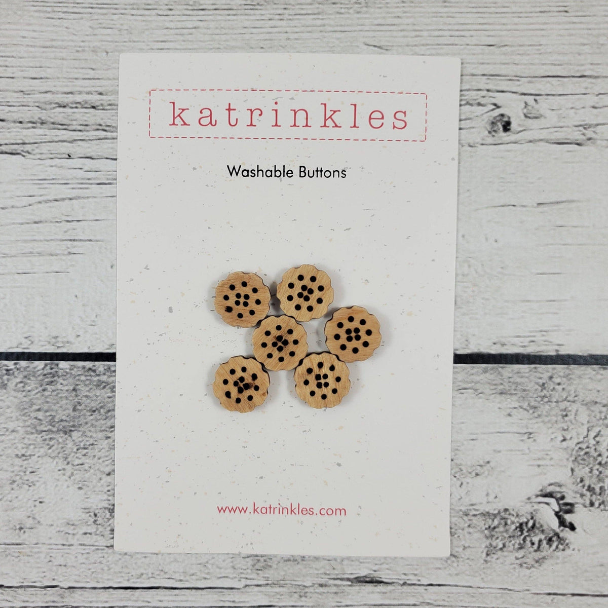 Katrinkles Washable Buttons in a beige color shaped like bachelor buttons flowers
