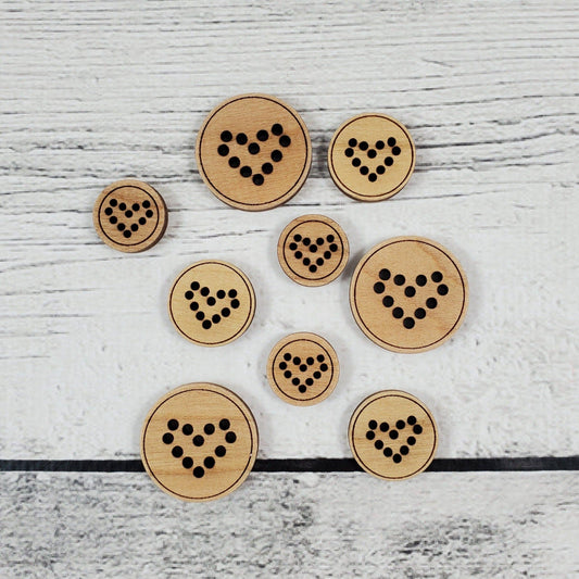 Katrinkles heart buttons in various sizes made of natural wood with black dot designs