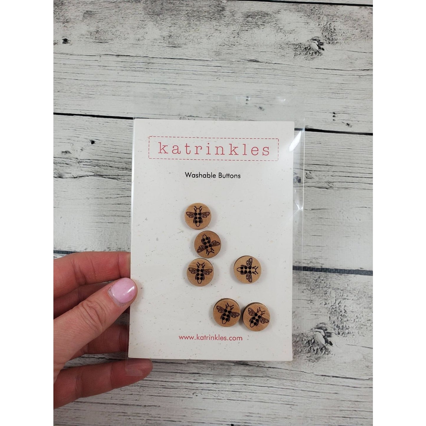 Katrinkles Washable Buttons featuring honey bee design on wooden material for crafting projects