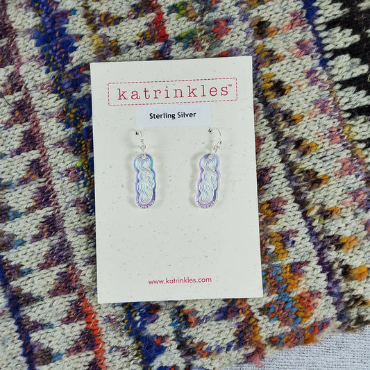 Katrinkles iridescent earrings on a display card, showcasing a unique design in sterling silver