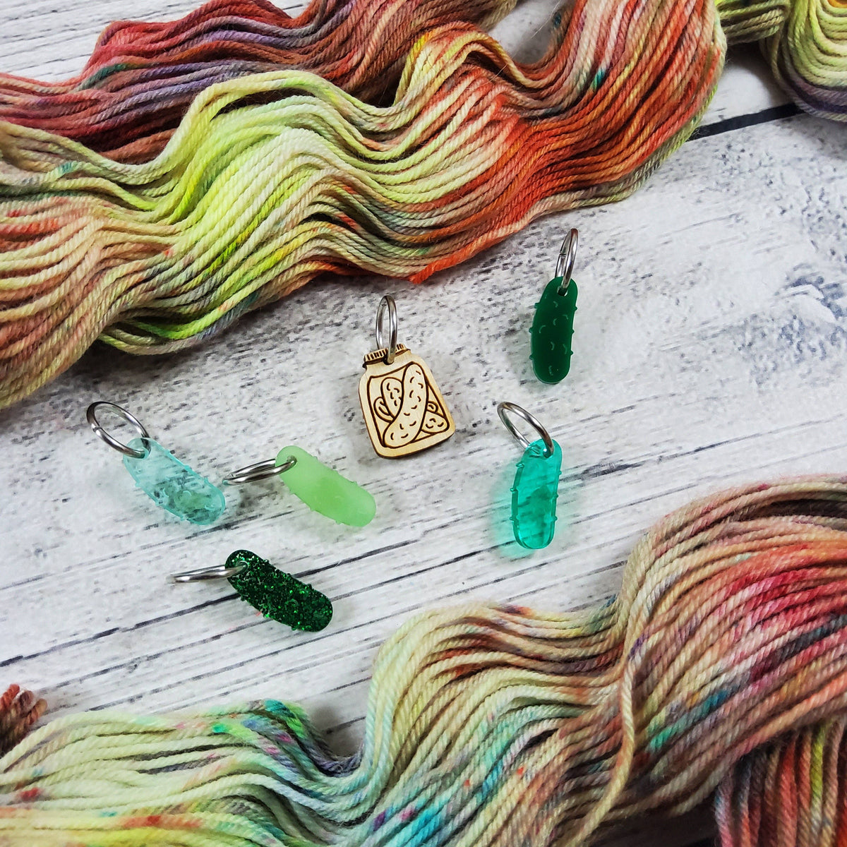 Colorful Katrinkles stitch markers for crocheting on vibrant yarn background
