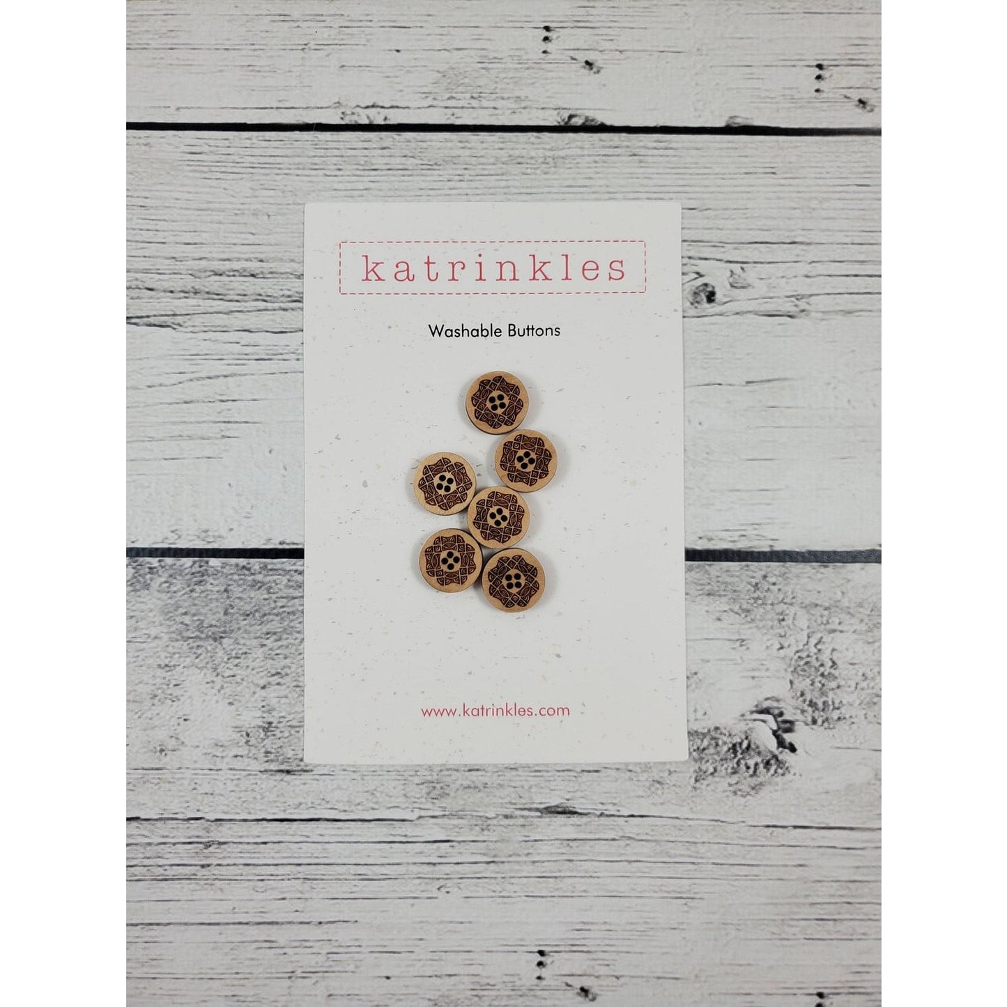 Katrinkles washable buttons in a floral design on a card for crafting projects
