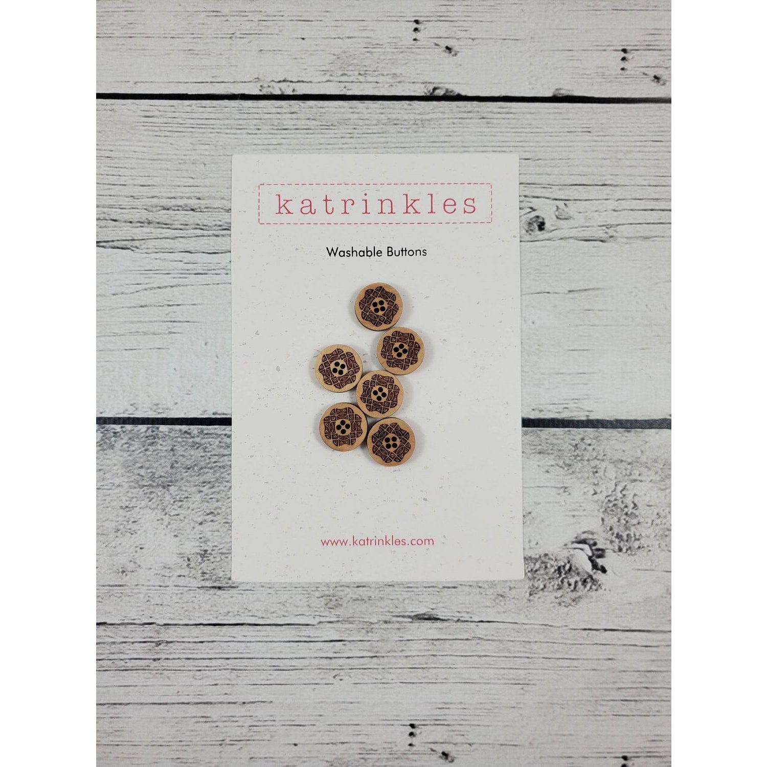 Katrinkles washable buttons in a floral design on a card for crafting projects