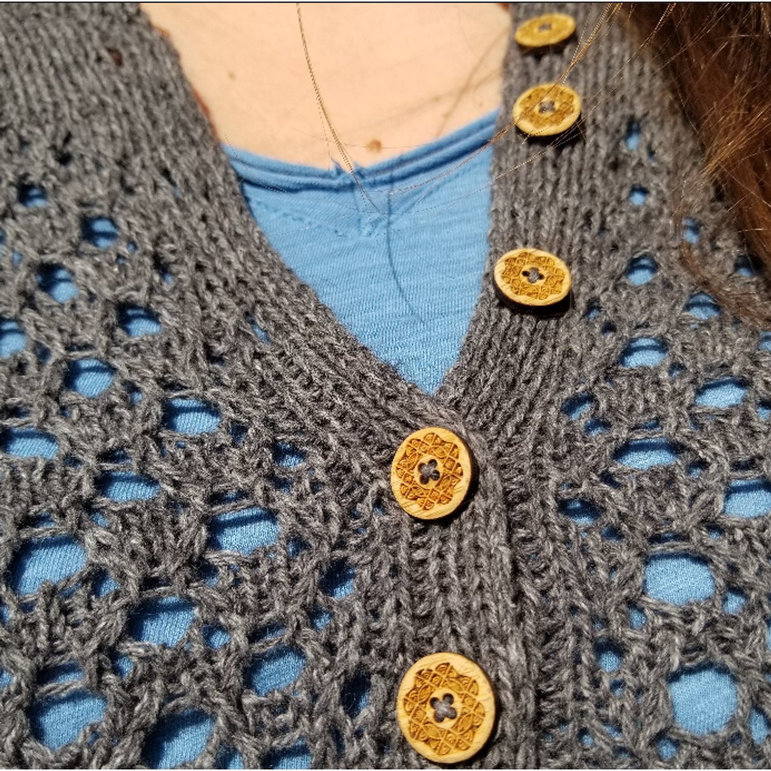 Katrinkles crochet cardigan with decorative wooden buttons and lace detailing for stylish layering