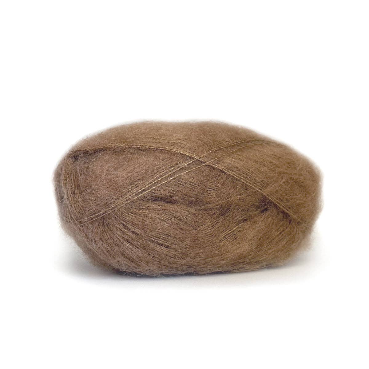 Soft brown Kelbourne Woolens Harmony yarn in a delicate ball, perfect for knitting projects
