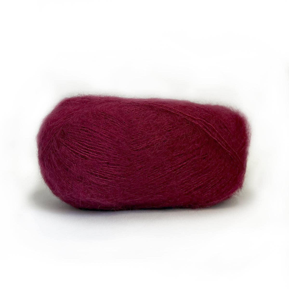 Kelbourne Woolens Harmony yarn in rich burgundy color, perfect for cozy knitting projects
